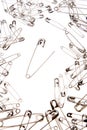 Safety pins on white Royalty Free Stock Photo