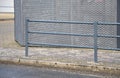 Safety railings on the sidewalk protect people from falling into the traffic road. railings are most often installed at schools an