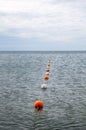 Safety rope and float line in the sea Royalty Free Stock Photo