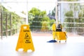 Safety sign with phrase Caution wet floor Royalty Free Stock Photo