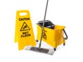 Safety sign with phrase Caution wet floor, mop and bucket on white background. Cleaning service Royalty Free Stock Photo