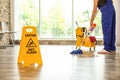 Safety sign with phrase Caution wet floor Royalty Free Stock Photo