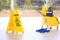 Safety sign with phrase Caution wet floor Royalty Free Stock Photo