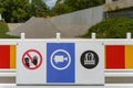 Safety signs on a construction barrier in a work site Royalty Free Stock Photo