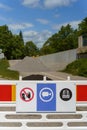 Safety signs on a construction barrier in a work site Royalty Free Stock Photo