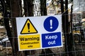 Safety signs on the outside of a building site in England Royalty Free Stock Photo