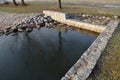 Safety spillway of a lake dam, pond or other water area, reservoir. in case of clogging of the sluice, the water will drain out on