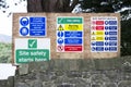 Safety starts here and health safety construction board notice signs where building works are taking place Royalty Free Stock Photo