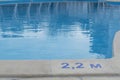 safety on water concept, close up image of signs of depth in meters in swimming pool, Royalty Free Stock Photo