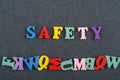 SAFETY word on black board background composed from colorful abc alphabet block wooden letters, copy space for ad text. Learning Royalty Free Stock Photo