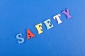 SAFETY word on blue background composed from colorful abc alphabet block wooden letters, copy space for ad text. Learning english Royalty Free Stock Photo