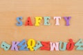 SAFETY word on wooden background composed from colorful abc alphabet block wooden letters, copy space for ad text Royalty Free Stock Photo