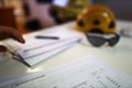 Safety workplace construction worker organising job hazard Assessment (JHA) work permit paper document