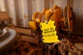 Yellow out of service tag attached on faulty damage defect of heavy duty lifting beam trolley at construction site Perth