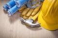 Safety workwear blueprints claw hammer on wooden board construct Royalty Free Stock Photo