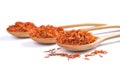 Safflower petals in a spoon on white background Royalty Free Stock Photo