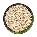 Safflower seeds in round bowl isolated