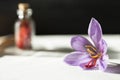 Saffron flower and dried saffron spice in a bottle Royalty Free Stock Photo