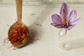 Saffron flower and spoon with saffron spice types Royalty Free Stock Photo