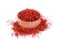 Saffron spice in wood bowl isolated on white background Royalty Free Stock Photo