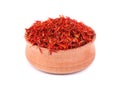 Saffron spice in wood bowl isolated on white background Royalty Free Stock Photo