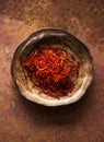 Saffron spices in a bowl. Indian spice top view