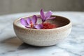 Saffron stigmas and flowers resting in a ceramic bowl Royalty Free Stock Photo