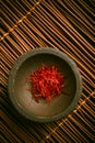 Saffron threads in a small bowl. Spices, cooking ingredients, flavor