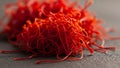 Saffron threads on stone surface close-up. Royalty Free Stock Photo