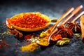 Saffron. Various Indian Spices on black stone table. Spice and herbs on slate background Royalty Free Stock Photo