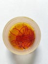 Saffron water in white background Royalty Free Stock Photo