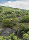 Safranbolu, Karabuk/Turkey-June 30 2019: Tourist sliding on a zip line in Incekaya Canyon just near Kristal Cam Teras