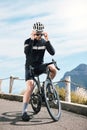 Saftey first. Full length shot of a handsome mature man taking a break while cycling outdoors. Royalty Free Stock Photo