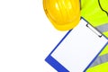 Saftey hi vis vest and hard hat with a clipboard Royalty Free Stock Photo