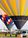 Hot air balloons inflating and getting ready for take off during Saga International Balloon Fiesta in Japan Royalty Free Stock Photo