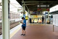 Saga, Japan:September 1, 2016 - Portrait Asian man standing and reading the map at the platform of the train station during