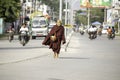 Sagaing/Myanmar-October 3rd 2019: A Burmese elderly monk is walking for food donations from Buddhists. The morning routines of Bud