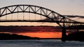 Sagamore Bridge at Sunrise with a boat Royalty Free Stock Photo