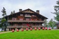 Sagamore Lake, NY: A row of Adirondacks chairs on the lawn