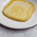 A saganaki Greek fried goat cheese traditional ethnic plate close up, served in a white dish. Royalty Free Stock Photo