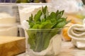Sage bunch in a plastic container on a kitchen counter top Royalty Free Stock Photo