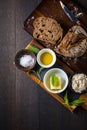 Sage butter with olive oil, salt and fresh bread slice on rustic table Royalty Free Stock Photo
