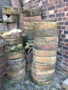 Spent sagger containers stacked by the wall