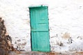 Sagging blue door old white wall front, Canary islands, Spain