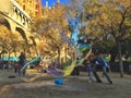 SAGRADA FAMILIA, BARCELONA, December 2015- child have fun with soap bubbles made by street artist