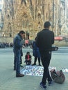 SAGRADA FAMILIA, BARCELONA, December 2015-street sellers sale souvenirs a front of Sagrada familia