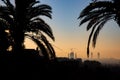 Sagrada Familia cathedral silhouettein the sunrise, framed by trees, Barcelona, Spain