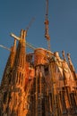 Sagrada Familiar Catholic Cathedral at bloody sunset during construction in Barcelona, Spain, cityscape, closeup