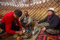 Kazakh family of hunters with golden eagles inside the mongolian Yurt. In Bayan-Olgii Province is populated mainly by Kazakhs