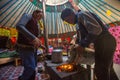 Kazakh family of hunters with golden eagles inside the mongolian Yurt. In Bayan-Olgii Province is populated mainly by Kazakhs